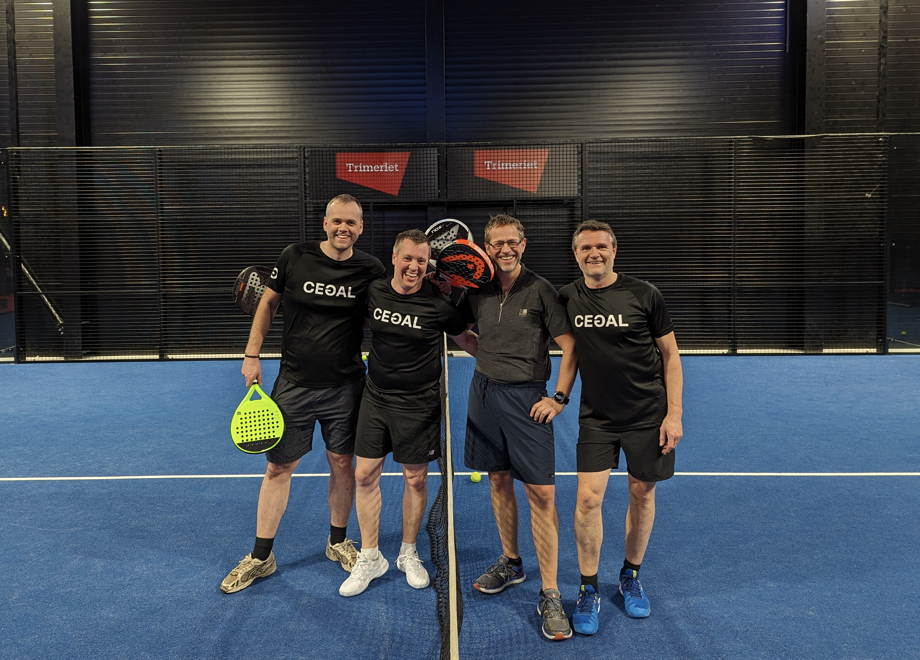 Four guys on a Padel court