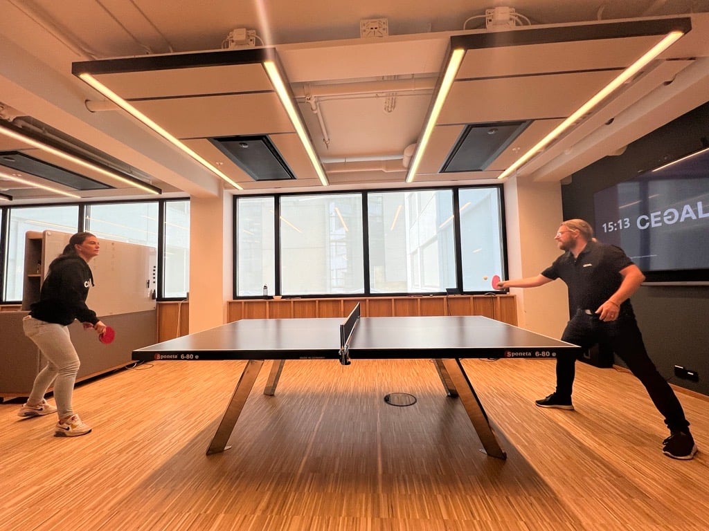 Two people playing ping pong