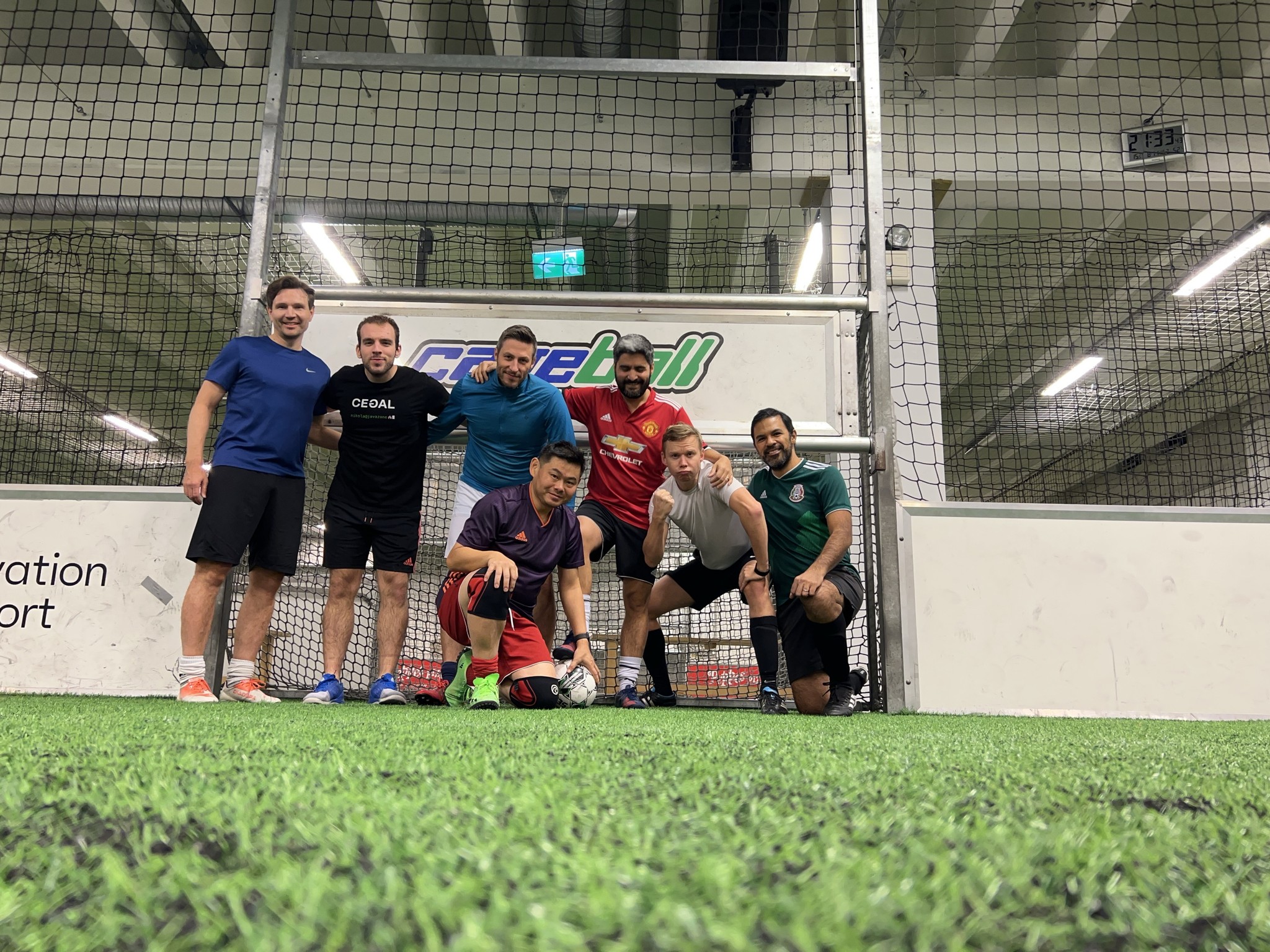 A group of guys playing Cageball