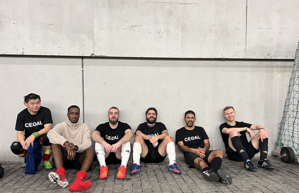 A group of guys playing soccer