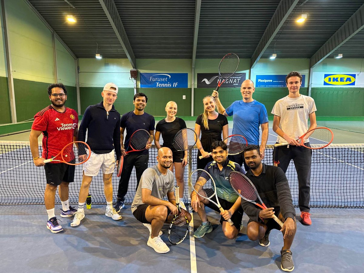 Group of people playing Tennis
