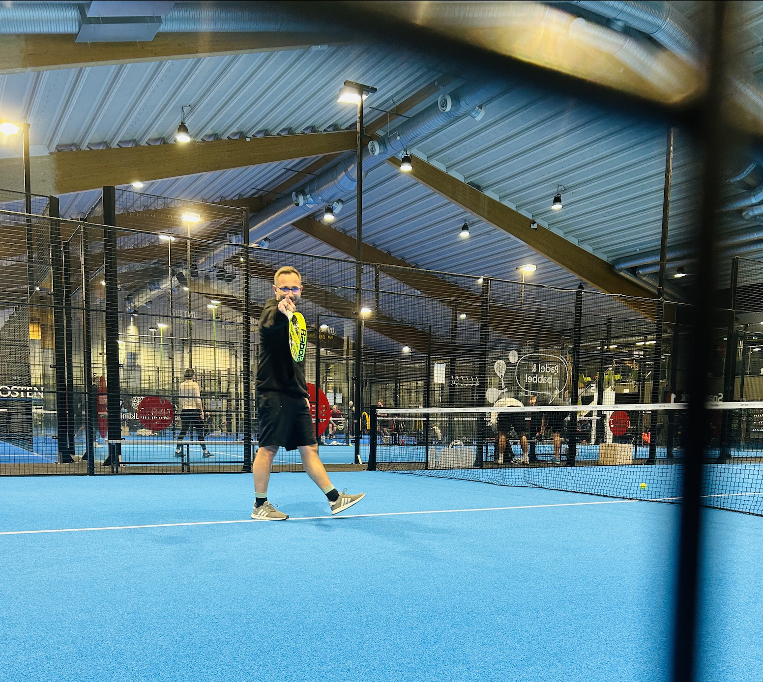 A guy playing padel